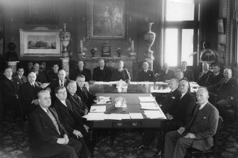 Black & white photo, board or committe meeting (all men in suits) of unknown date