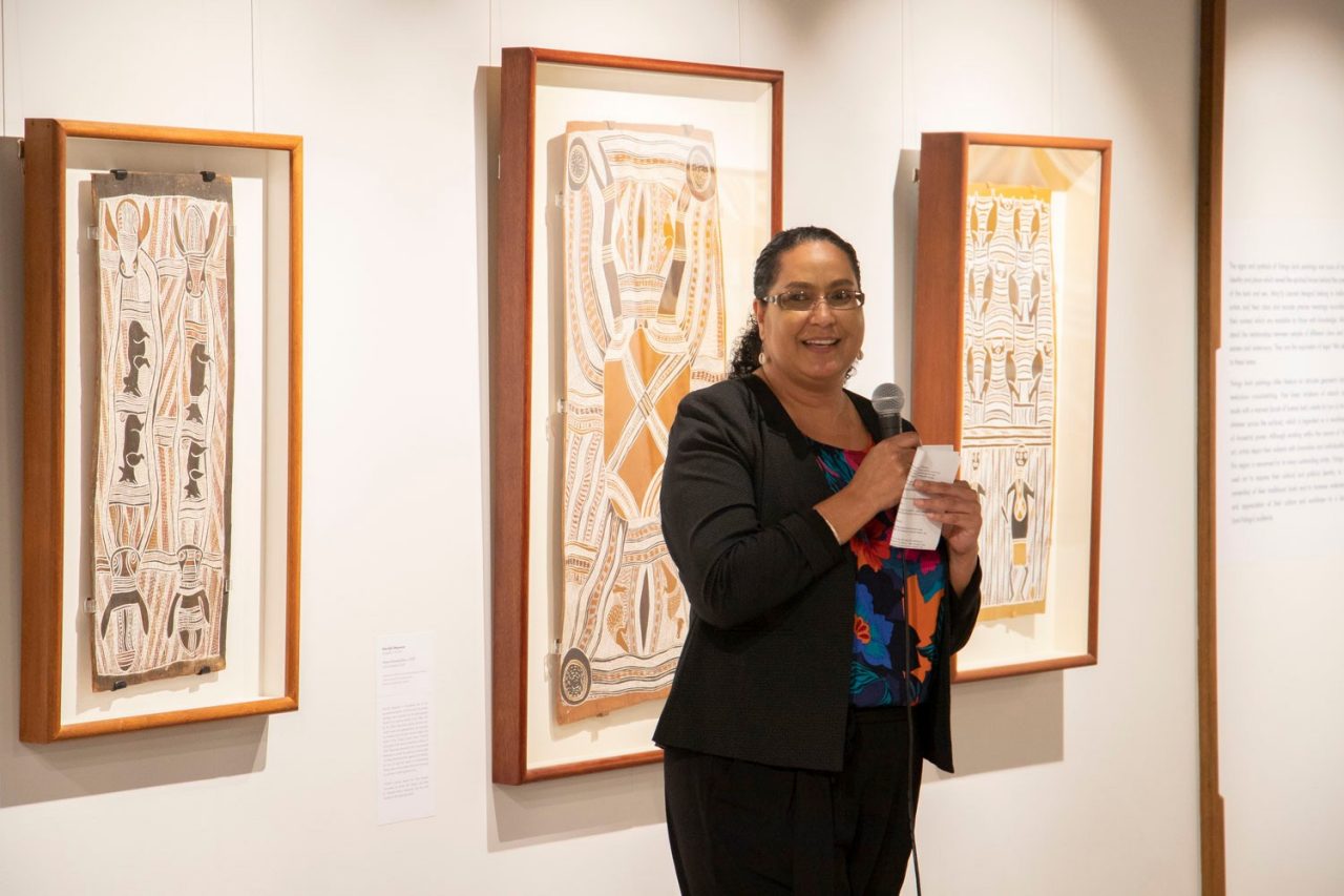 Helen Anu standing in front of installation speaking at the opening of Sea Country